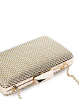 Gold beaded clutch bag on a white background