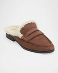brown slide on shoe with white fur lining on a white background