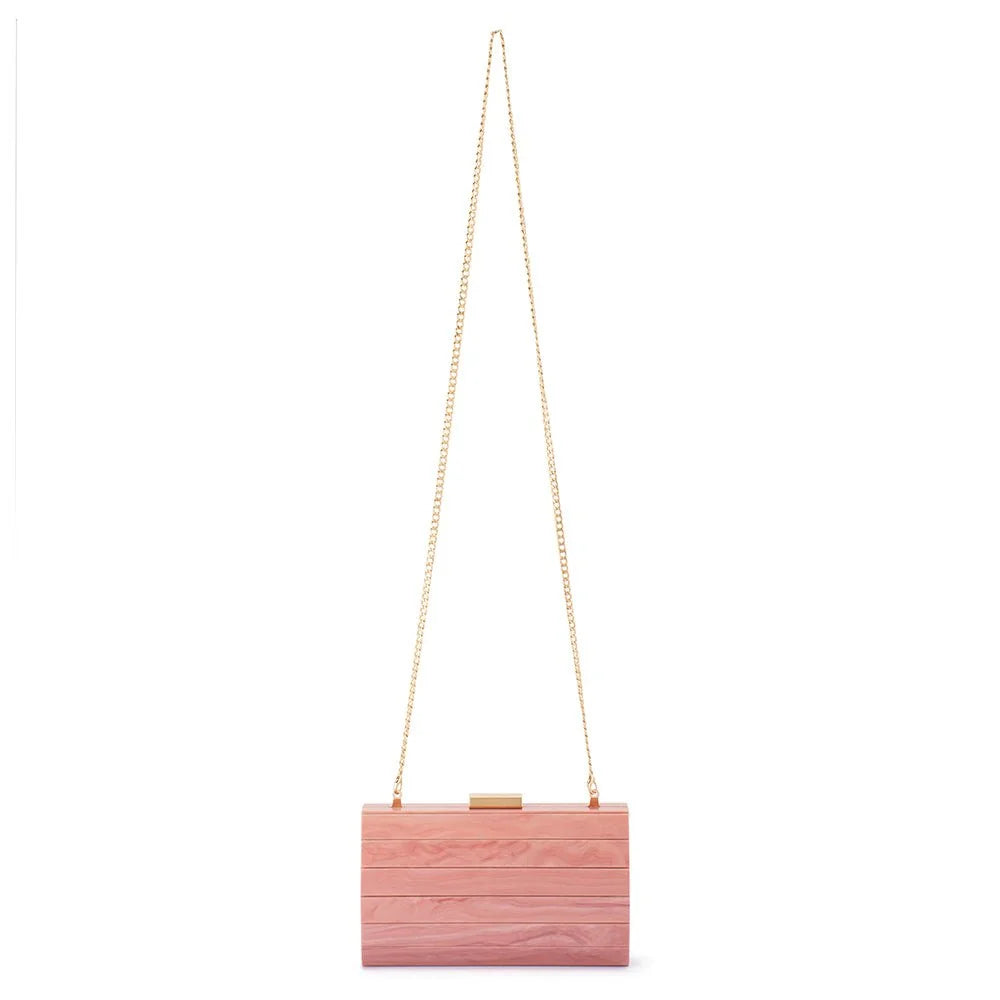 A pink wooden clutch bag with a gold chain strap and a small gold clasp, shown against a plain white background.