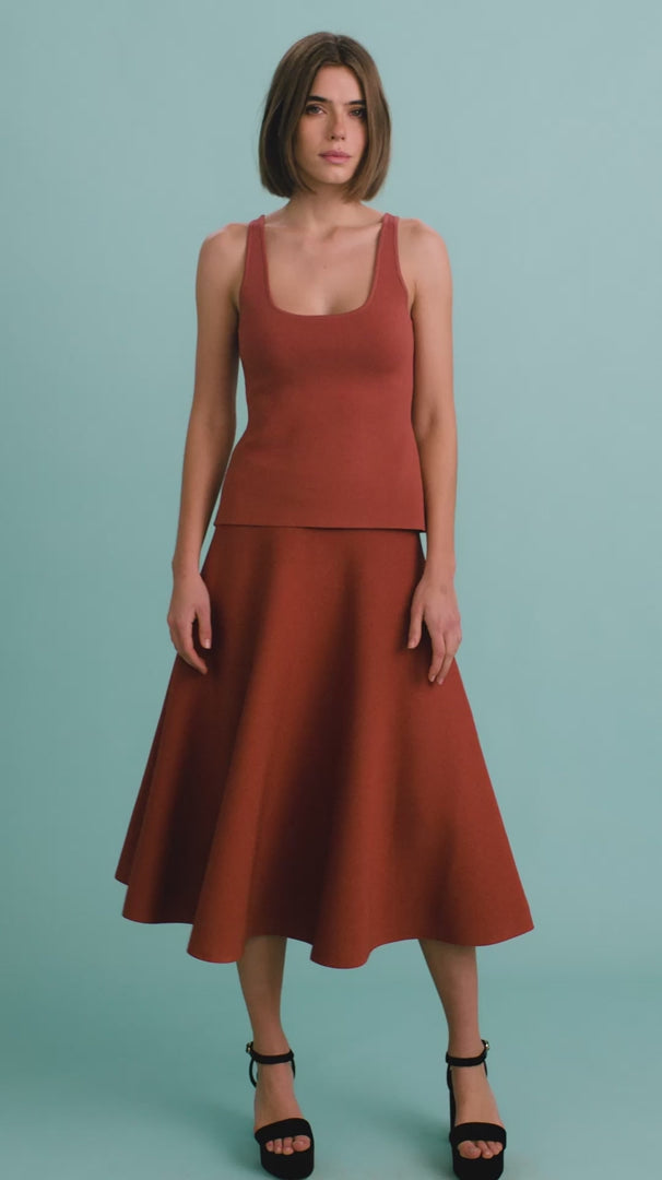video of a model wearing a rust colored tank and skirt set
