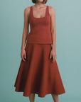 video of a model wearing a rust colored tank and skirt set