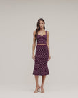 model wearing a mathing polka dot outfit
