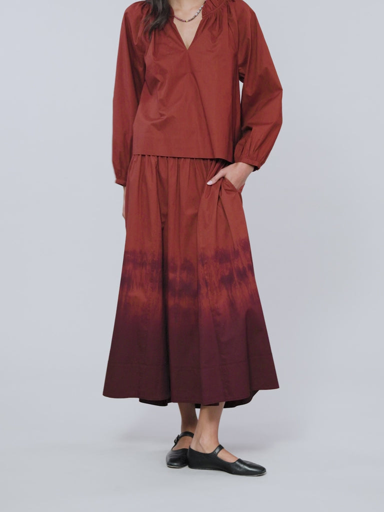 Woman modeling the Gwynn Skirt in copper brown