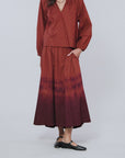 Woman modeling the Gwynn Skirt in copper brown