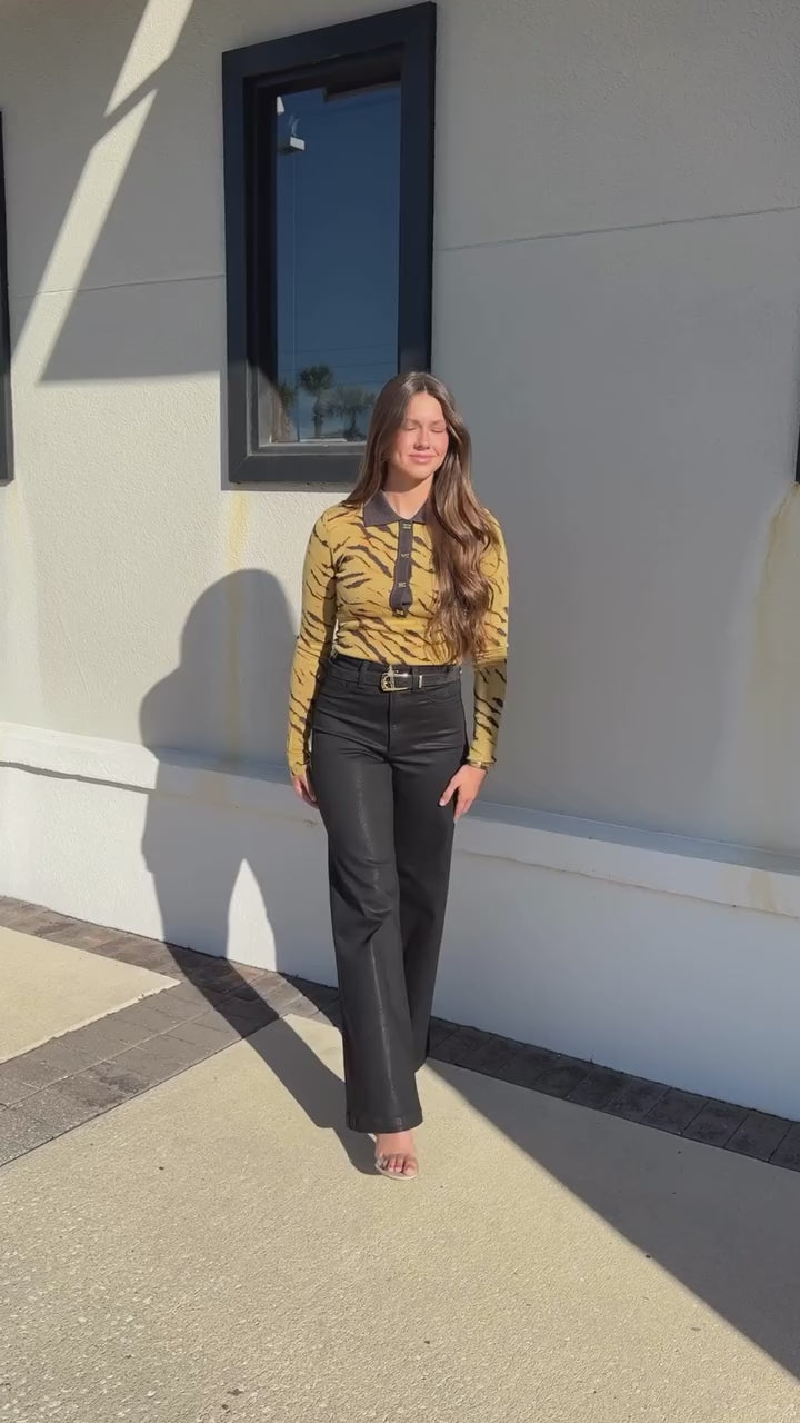 Model walking forward wearing Pistola denim and Fine Merino Jacquard Polo