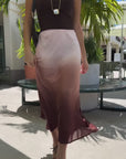 woman in dark brown tank top and ombre midi skirt