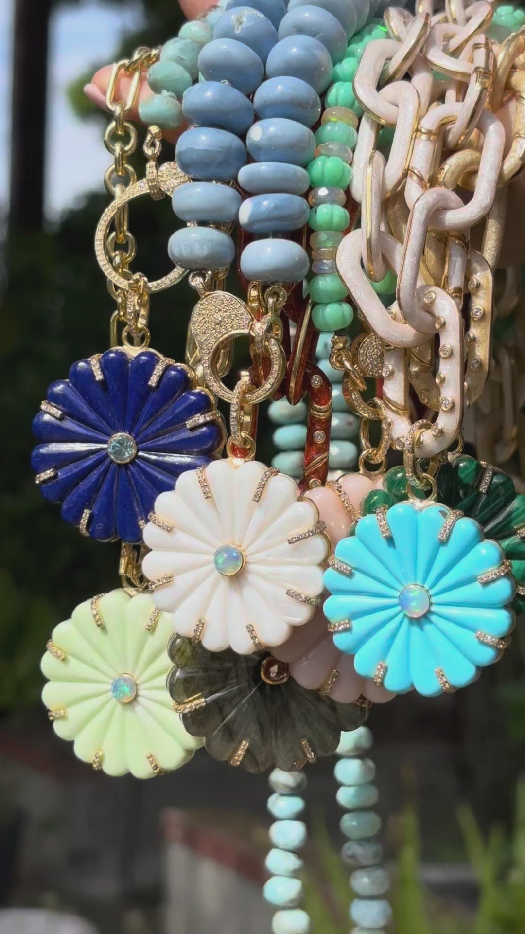 video of daisy pendants on chains and beads