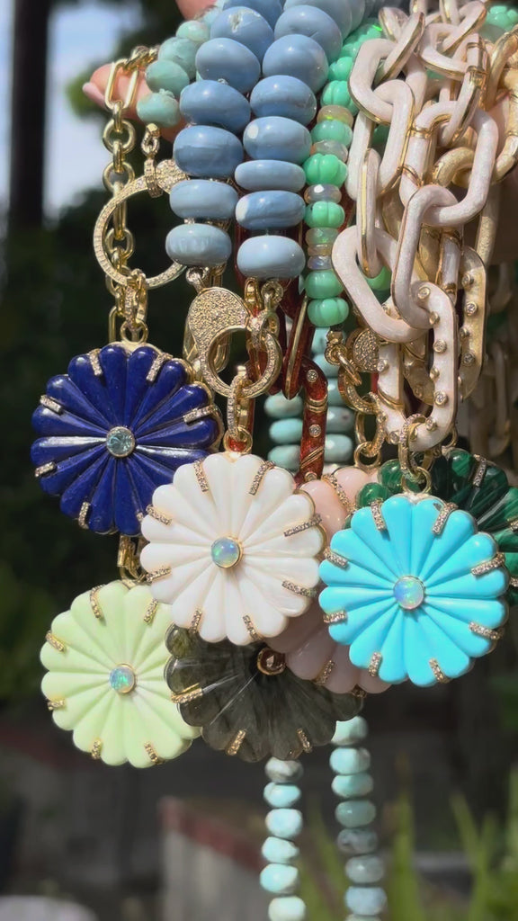 video of daisy pendants on chains and beads
