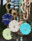 video of daisy pendants on chains and beads