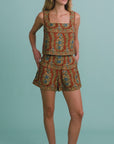 video of a woman modeling a matching floral tank and short set