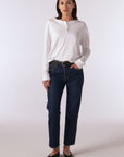 video of model wearing cropped jeans, flats and white long sleeve henley