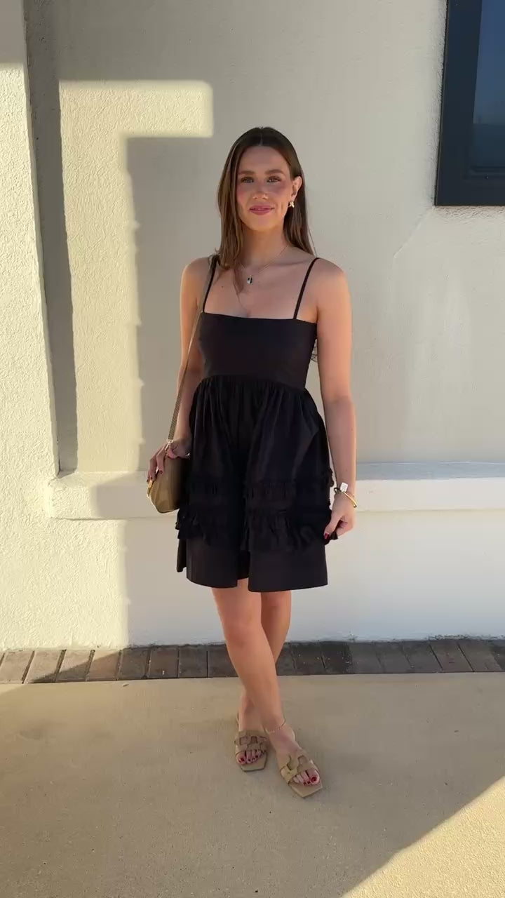 Model wearing Mini Strap Dress with Frills spinning