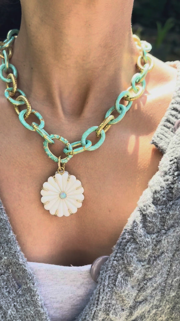 video of daisy pendant on a chain