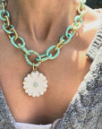 video of daisy pendant on a chain