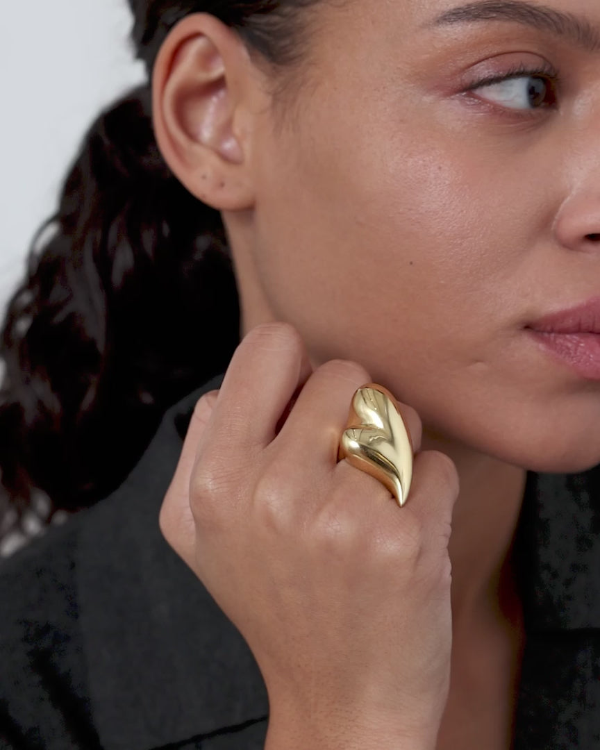video of mode wearing a gold heart ring