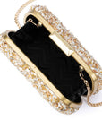 clutch with crushed shells and gold details on a white background, open from top with black inside