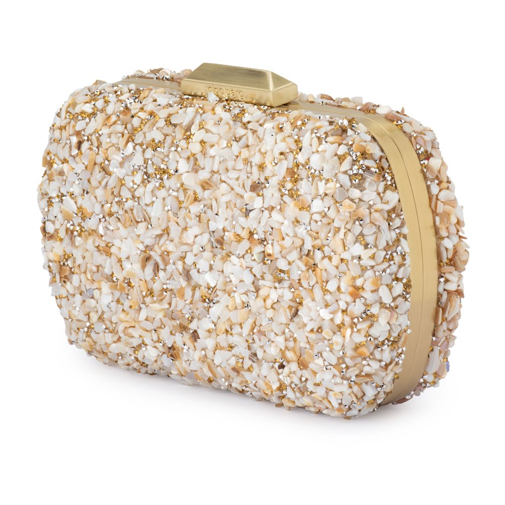 clutch with crushed shells and gold details on a white background 