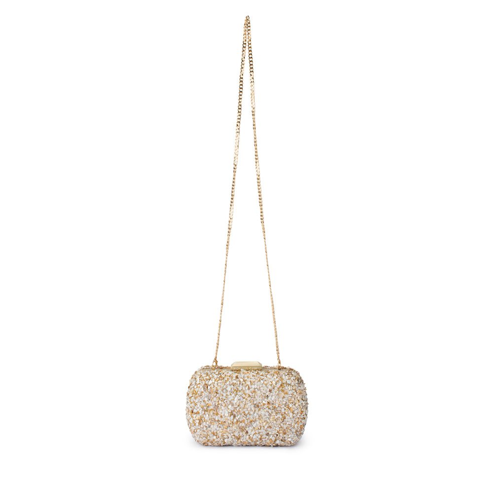 clutch with crushed shells and gold details on a gold chain, on a white background 