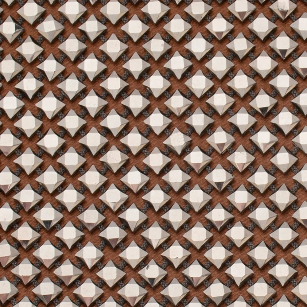 close up of clutch bag with a brown pattern and a metallic silver diamond mesh overlay