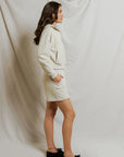 model wearing a zip up hoodie and lounge shorts in the color oatmeal