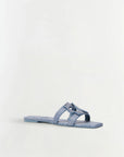 Blue sandal on a light gray background