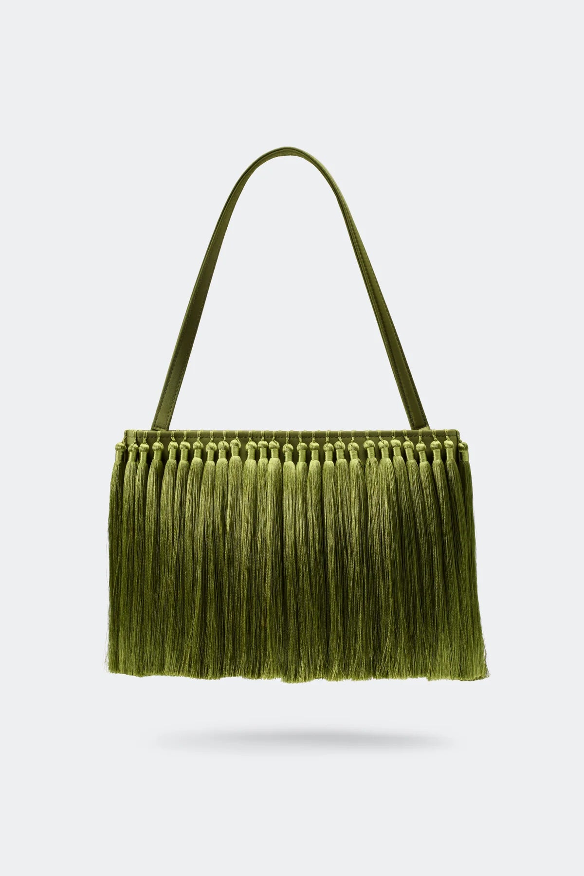 Green fringed handbag on a white background