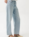 Light blue jeans worn by a person on a white background