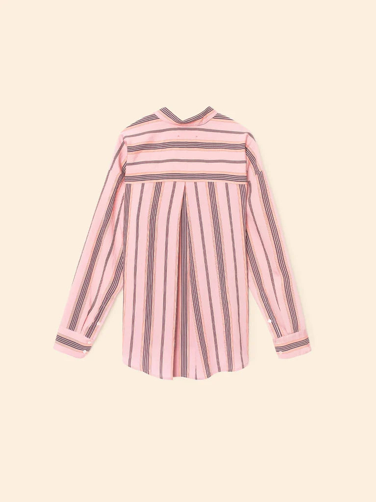 Pink and black striped dress on a beige background back view