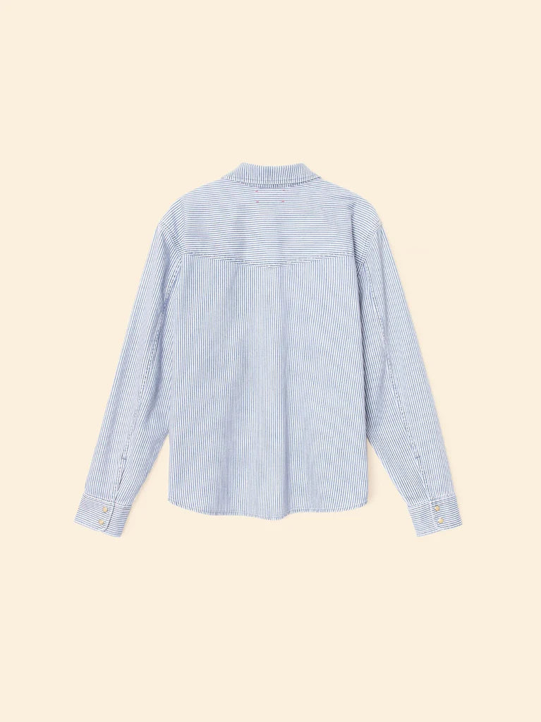 Light blue striped shirt on a beige background