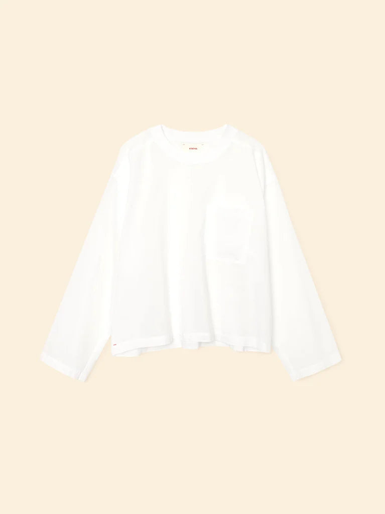 White blouse on a beige background