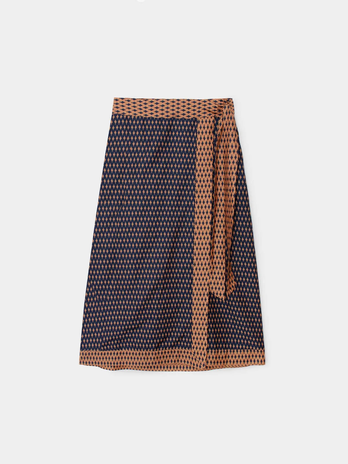 A wrap-style skirt with a dark navy base and a dense small-scale geometric pattern in brown and white, featuring a matching brown patterned waistband and tie belt.
